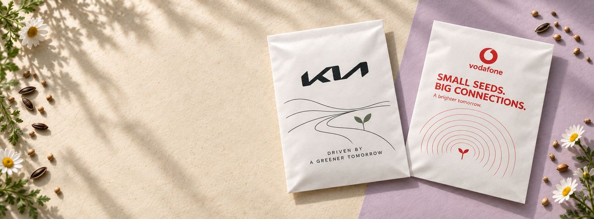 Kia and Vodafone personalised white paper seed favours with blank print margins, surrounded by daisies
